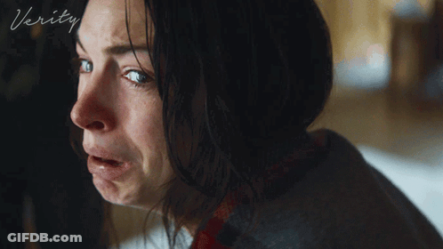 A Close Up Of A Woman 'S Face With The Word Verity On The Bottom Right GIF