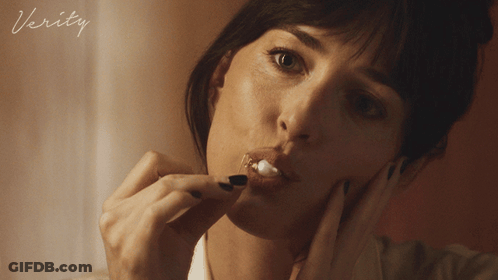 A Close Up Of A Woman 'S Face With The Word Verity On The Bottom Right GIF