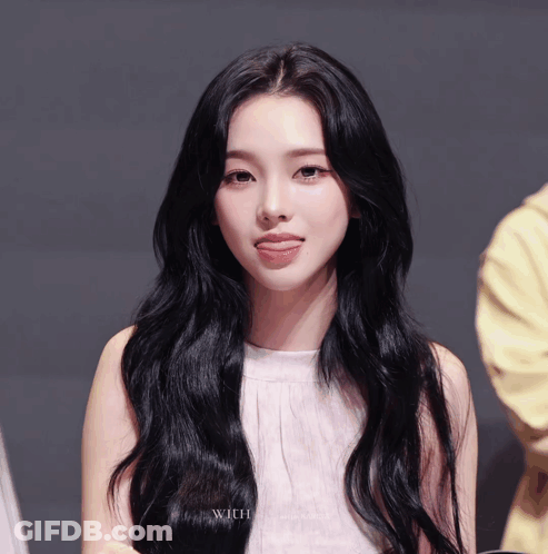 A Close Up Of A Woman 'S Face With The Word With On The Bottom Right GIF