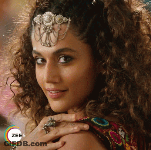 A Close Up Of A Woman 'S Face With The Word Zee5 On The Bottom Left GIF