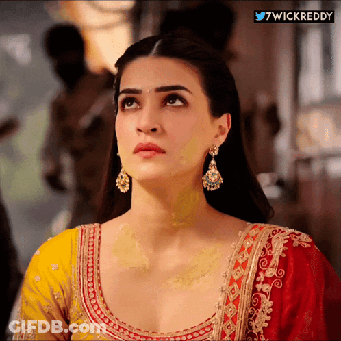 A Close Up Of A Woman 'S Face With The Words 7Wickreddy On The Bottom GIF