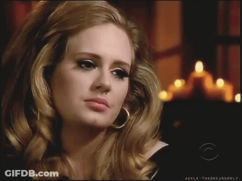 A Close Up Of A Woman 'S Face With The Words Adelk-Theoneandonly On The Bottom GIF