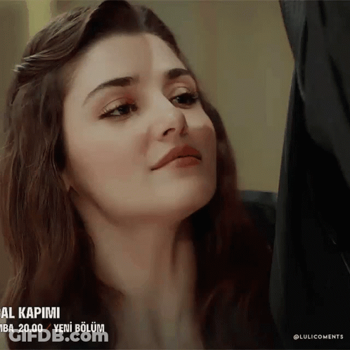 A Close Up Of A Woman 'S Face With The Words " Al Kapimi " On The Bottom Right GIF