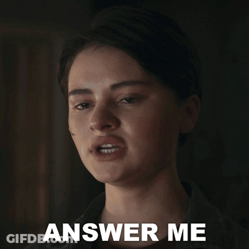 A Close Up Of A Woman 'S Face With The Words Answer Me Below It GIF
