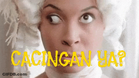 A Close Up Of A Woman 'S Face With The Words Cacingan Ya In Yellow GIF