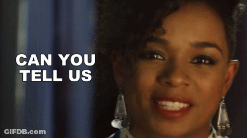 A Close Up Of A Woman 'S Face With The Words Can You Tell Us Behind Her GIF