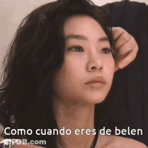 A Close Up Of A Woman 'S Face With The Words Como Cuando Eres De Belen GIF