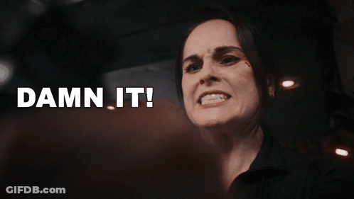 A Close Up Of A Woman 'S Face With The Words Damn It Behind Her GIF