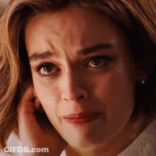 A Close Up Of A Woman 'S Face With The Words Death And Nile On The Bottom Right GIF