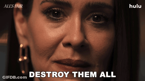 A Close Up Of A Woman 'S Face With The Words " Destroy Them All " On The Bottom GIF