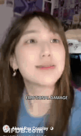 A Close Up Of A Woman 'S Face With The Words " Emotional Damage " Above Her GIF