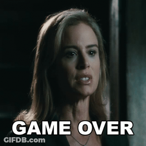 A Close Up Of A Woman 'S Face With The Words Game Over Behind Her GIF