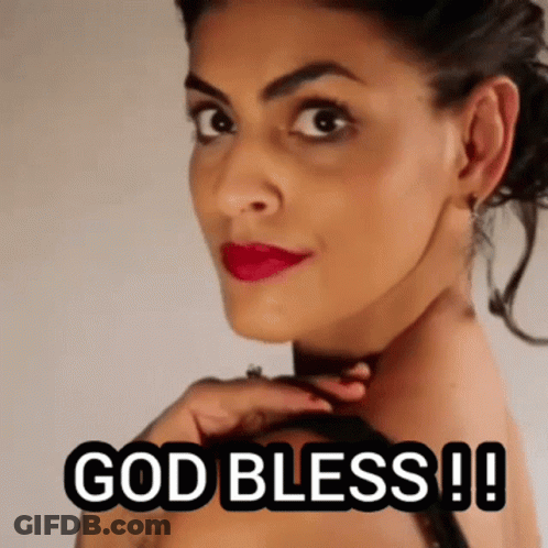 A Close Up Of A Woman 'S Face With The Words `` God Bless ! '' GIF