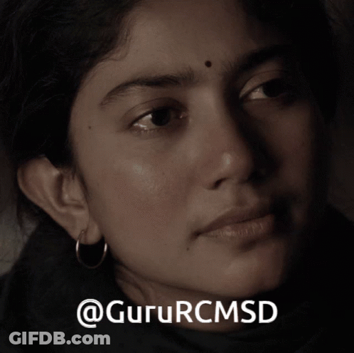 A Close Up Of A Woman 'S Face With The Words Gururcmsd On The Bottom Right GIF