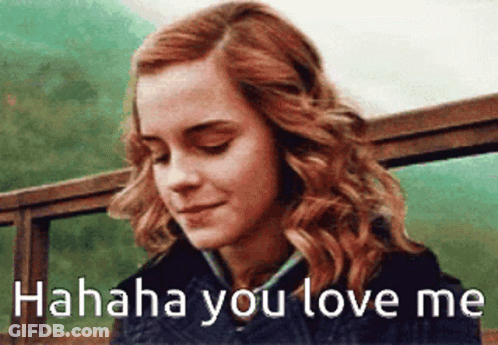 A Close Up Of A Woman 'S Face With The Words ' Hahahaha You Love Me ' On The Bottom . GIF
