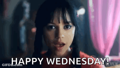 A Close Up Of A Woman 'S Face With The Words `` Happy Wednesday '' Written On It . GIF