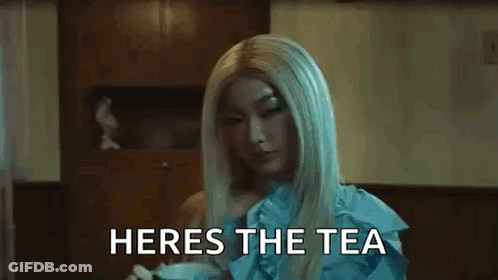 A Close Up Of A Woman 'S Face With The Words Heres The Tea Written Below Her GIF