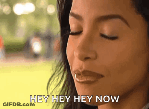 A Close Up Of A Woman 'S Face With The Words Hey Hey Hey Now Written Below Her GIF
