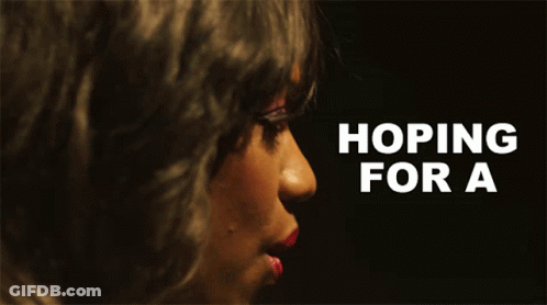 A Close Up Of A Woman 'S Face With The Words Hoping For A GIF