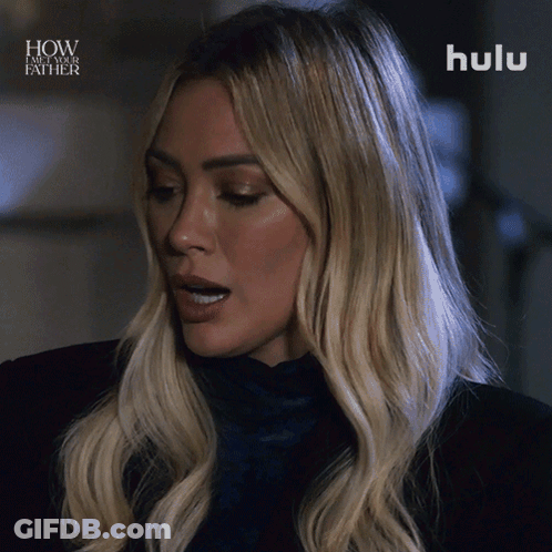 A Close Up Of A Woman 'S Face With The Words How I Met Your Father Above Her GIF