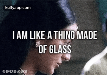A Close Up Of A Woman 'S Face With The Words `` I Am Like A Thing Made Of Glass '' Written On It . GIF