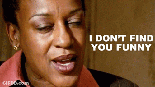A Close Up Of A Woman 'S Face With The Words I Don 'T Find You Funny Above Her GIF