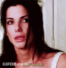 A Close Up Of A Woman 'S Face With The Words `` I Don 'T Know '' Written On It . GIF
