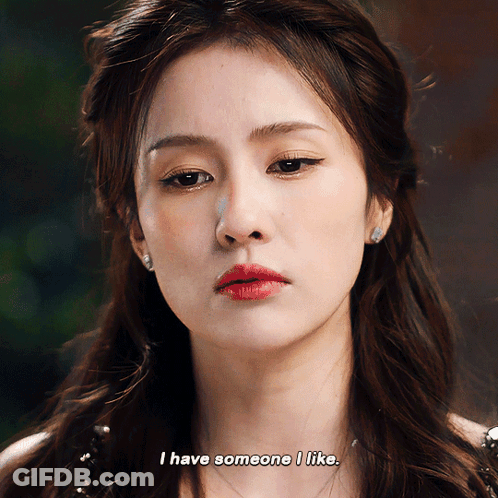 A Close Up Of A Woman 'S Face With The Words I Have Someone I Like GIF