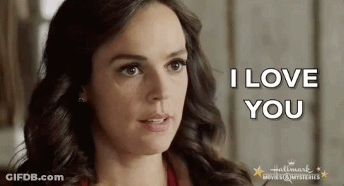 A Close Up Of A Woman 'S Face With The Words I Love You Written On It GIF