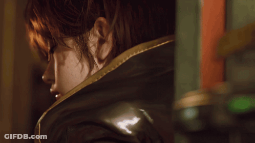 A Close Up Of A Woman 'S Face With The Words " I 'M Listening " Below Her GIF