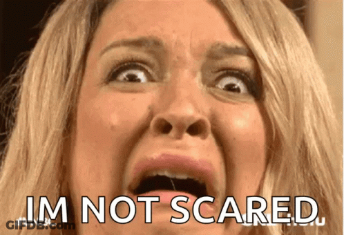 A Close Up Of A Woman 'S Face With The Words I 'M Not Scared On The Bottom GIF