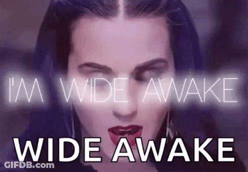 A Close Up Of A Woman 'S Face With The Words `` I 'M Wide Awake Wide Awake '' GIF
