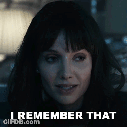 A Close Up Of A Woman 'S Face With The Words I Remember That Behind Her GIF