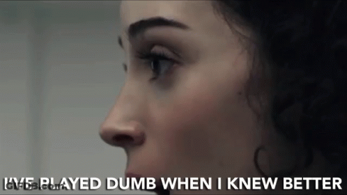 A Close Up Of A Woman 'S Face With The Words I 'Ve Played Dumb When I Knew Better Below It GIF