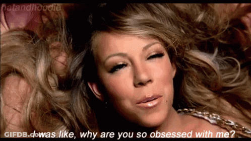 A Close Up Of A Woman 'S Face With The Words I Was Like Why Are You So Obsessed With Me Written Below Her GIF