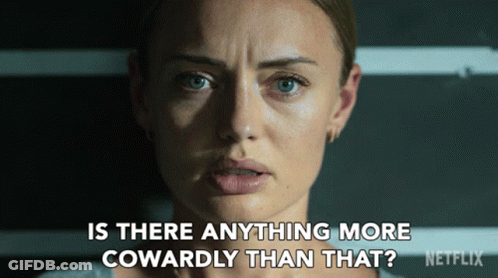 A Close Up Of A Woman 'S Face With The Words " Is There Anything More Cowardly Than That " Below Her GIF