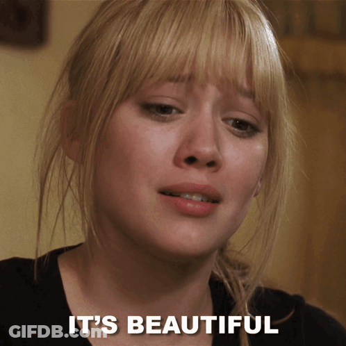 A Close Up Of A Woman 'S Face With The Words " It 'S Beautiful " Below Her GIF