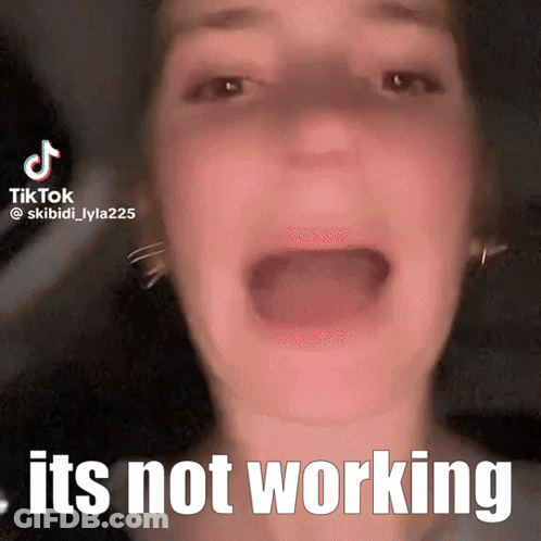 A Close Up Of A Woman 'S Face With The Words " It 'S Not Working " Written Below Her GIF
