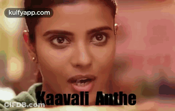 A Close Up Of A Woman 'S Face With The Words Kaavali Anthe Written In Black . GIF