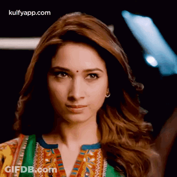A Close Up Of A Woman 'S Face With The Words Kulfyapp.com At The Top GIF