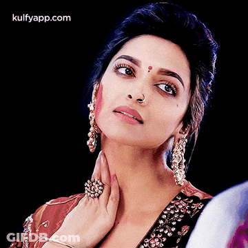 A Close Up Of A Woman 'S Face With The Words Kulfyapp.com On The Bottom Right GIF