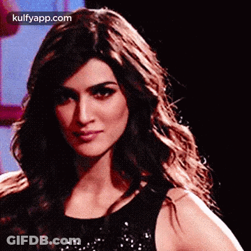 A Close Up Of A Woman 'S Face With The Words Kulfyapp.com On The Bottom Right Corner . GIF