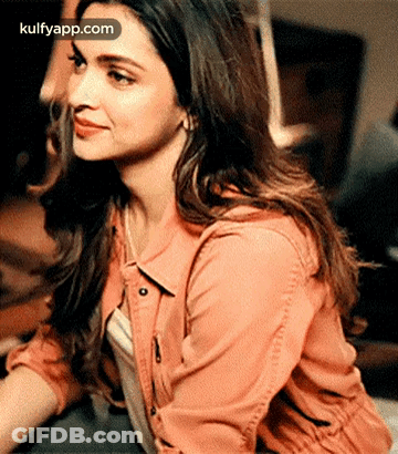 A Close Up Of A Woman 'S Face With The Words Kulfyapp.com On The Bottom Right GIF