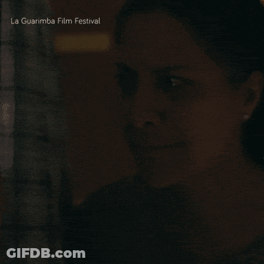 A Close Up Of A Woman 'S Face With The Words La Guarimba Film Festival Below GIF