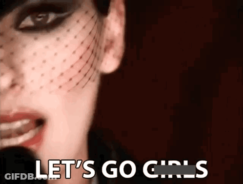 A Close Up Of A Woman 'S Face With The Words Let 'S Go Girls Written On It GIF