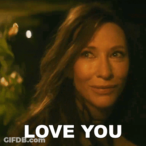 A Close Up Of A Woman 'S Face With The Words Love You Written On It GIF