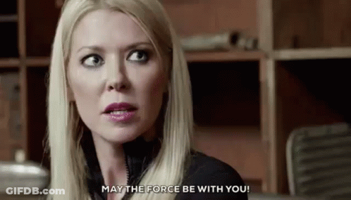 A Close Up Of A Woman 'S Face With The Words `` May The Force Be With You '' Written On The Bottom . GIF