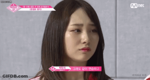 A Close Up Of A Woman 'S Face With The Words Mnet On The Bottom GIF