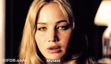 A Close Up Of A Woman 'S Face With The Words Mutant Written On Her Face . GIF