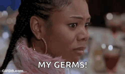 A Close Up Of A Woman 'S Face With The Words `` My Germs '' Written On Her Face . GIF